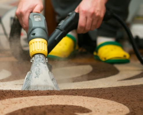 Worker Cleaning Carpet