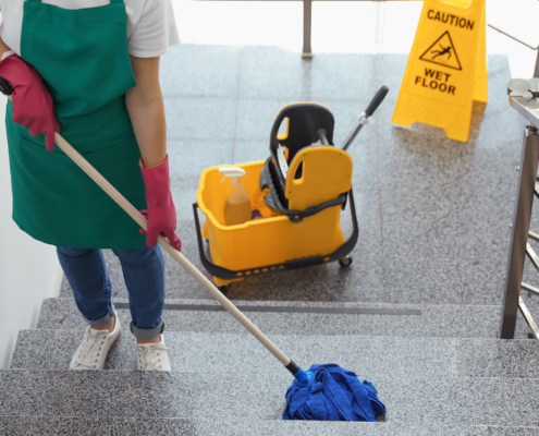 Worker Mopping Commercial Staircase